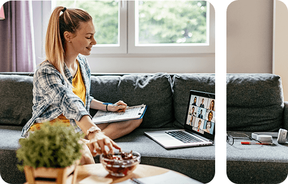 Woman sits on sofa and works on laptop