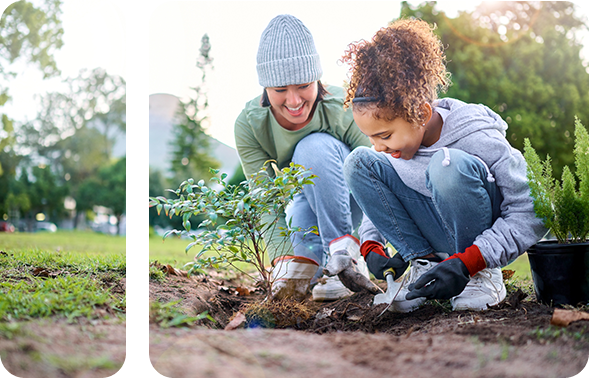 A woman and a child planting a tree.