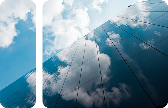 Clouds reflected in a glazed skyscraper.